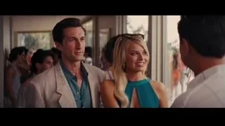 man and woman conversing in room — The Wolf Of Wall Street