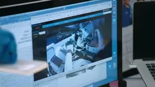 monitor displaying person in space suit — Elon Musk: Return to Space