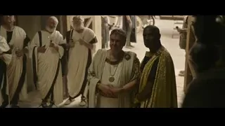 men in robes with wine glasses — Gladiator 2