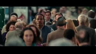 man with glasses walking in crowded street — The Amazing Spider Man 2