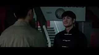 Two men talking in dimly lit room — Bruce Lee: Birth of The Dragon