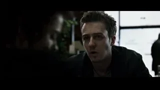 man in black jacket at restaurant table — Fight Club