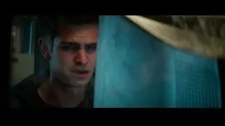 Young man's face in dimly lit room — The Amazing Spider Man 2