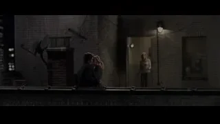 three people on rooftop at night — The Amazing Spider Man