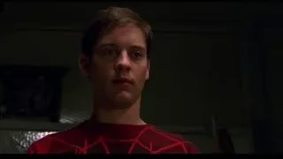 young man with serious expression in dim room — Spider Man
