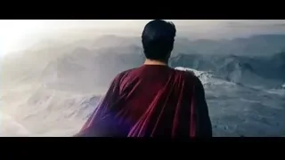 man standing on mountain wearing red cape — Superman: Man of Steel
