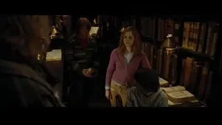 Man and boy reading in library — Harry Potter and the Goblet of Fire