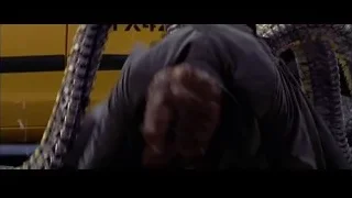 man holding chain on street — Spider Man 2