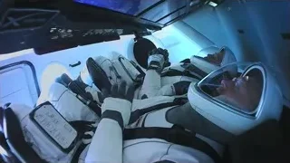 two astronauts in space station cockpit — Elon Musk: Return to Space