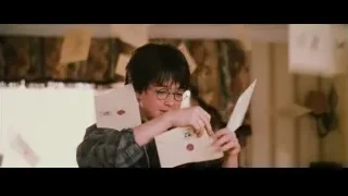 Young boy holding white envelopes — Harry Potter and the Philosophers Stone