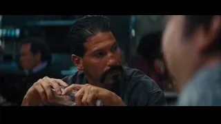 men talking at restaurant table — The Wolf Of Wall Street