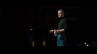 man speaking on stage with microphone — Steve Jobs