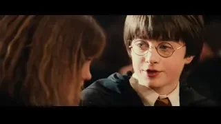 boy in suit and glasses looking at woman — Harry Potter and the Philosophers Stone