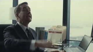 Man in suit sitting at office desk — Succession