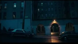 man walking in dark alleyway at night — Joker