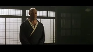 bald man in karate uniform by window — The Matrix