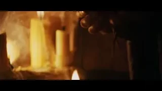 person's hand reaching for candle — Gladiator