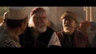 three men standing in desert setting — Gladiator