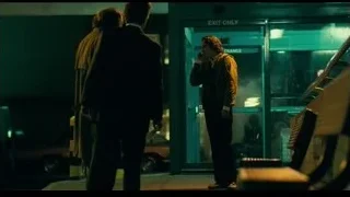 two men at 'EXIT ONLY' door — Joker