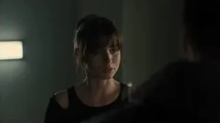 young woman looking at camera in dim room — Blade Runner 2049