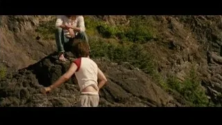 Man sitting on rocky cliff with boy — Into the Wild