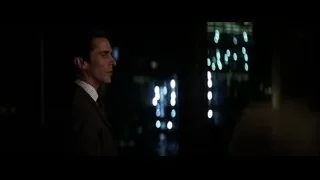 Man in suit looking at city at night — Batman: The Dark Knight