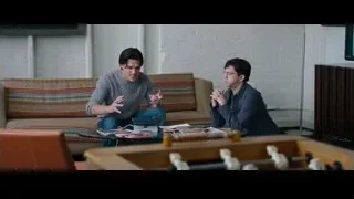 two young men conversing on couch — The Big Short