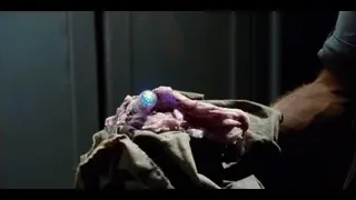 Man holding gun in dark room — Jurassic World