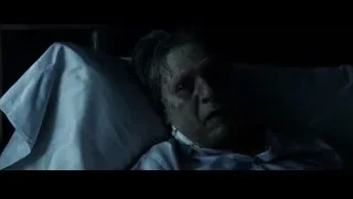 injured man in bed in dark room — The Amazing Spider Man 2