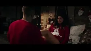 Couple in red sweaters on couch — Deadpool