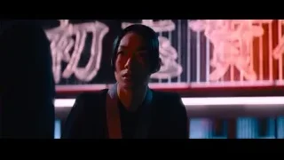 Young man in suit with neon signs — John Wick: Chapter 4