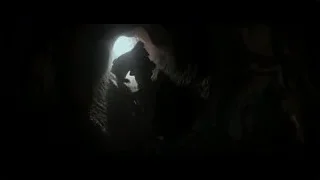 person standing inside a dark cave — Hacksaw Ridge