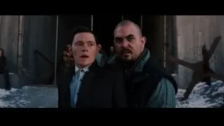 Two men standing in snowy alleyway — Batman: The Dark Knight Rises