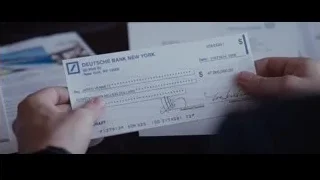 hand holding Deutsche Bank check for Jared Vennett — The Big Short
