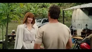 Man and woman in garden with vintage caravan — Jurassic World