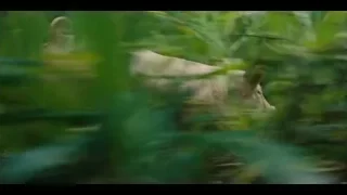 Hand reaching through tall green grass — Jurassic World