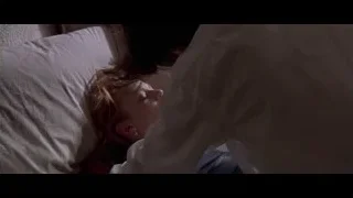 Woman lying in bed with black cat — American Psycho