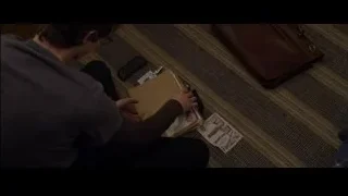man sitting on floor reading book — The Amazing Spider Man