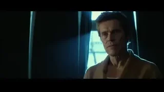 man standing by blue lit window — John Wick
