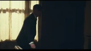 young woman standing in dimly lit room — Peaky Blinders