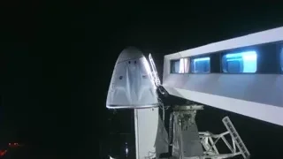 White spacecraft illuminated by blue light at night — Elon Musk: Return to Space