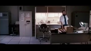 Man sitting at cluttered office desk — Jobs