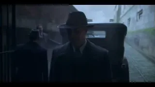 rear-view mirror showing two people in car — Peaky Blinders