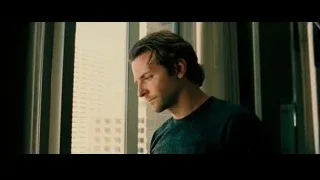 man looking out window — Limitless