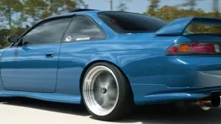 blue sports car driving on road — Sports Cars