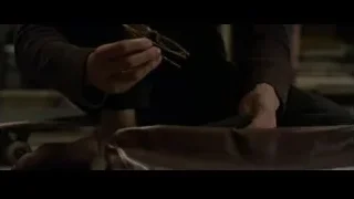 hands opening brown leather bag — The Amazing Spider Man