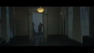 Two women standing in dimly lit hallway — Doctor Strange 2