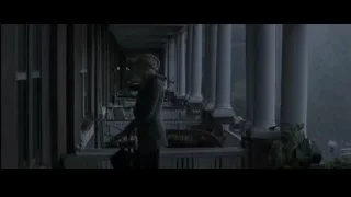 Woman standing on house porch with umbrella — The Amazing Spider Man