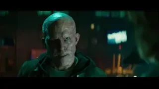 Bald man shouting in dark urban setting — Deadpool 2