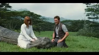 man and woman with crocodile in field — Jurassic World